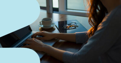 Woman completing taxes on laptop